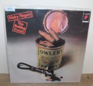 A Rolling Stones coloured vinyl Sticky Fingers in unique sleeve - appears to be a later press