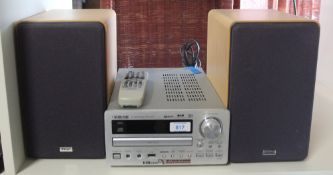 A Teac CD player with speakers and remote - please note remote has no back , a nice little system