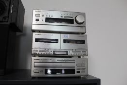 An Onkyo Stack system ( no speakers ) - CD CM716 - 6 disc changer with FM / Tuner Amp and double