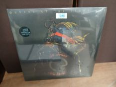 A Queens of The Stone Age LP NM/NM translucent blue vinyl album ' in times new roman ' 2023