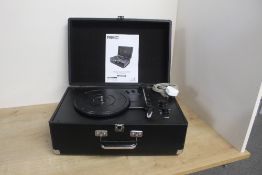 A Reka portable suitcase style turntable