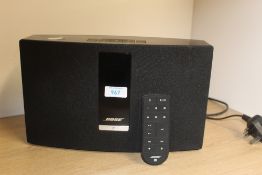 A Bose Bluetooth Soundtouch 20 speaker with remote and power supply