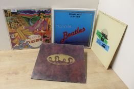 A Beatles Lot - seven records in total - a box set with six compilations - VG/VG or better , as ever