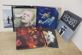 A fifteen album lot as in photos , decent selection of rock , pop and more on offer here , sleeves