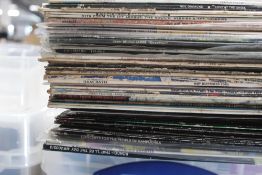 A lot of 40 mixed records as in photos , many genres with rock , pop and more - some excellent