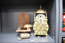 A brass lantern clock, thought to be 18th century, of typical form with single marker and a