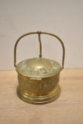 An early 19th-century brass hinged ice bucket, with an etched rose and floral design to lid and