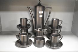 A set of 20th-century Portmeirion pottery matte black coffee service, to include six sets of cups