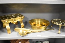 A selection of early 20th-century brassware, to include a Rampant Lion motif trivet; a decorative
