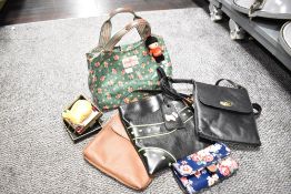 A collection of 2000s-modern handbags and purses, comprising a Cath Kidston green floral PVC