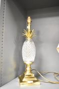 A modern Pineapple glass and metal table lamp, featuring a playful pineapple-shaped body with a