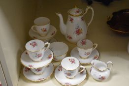 A New Chelsea fine bone china tea service having gilt edges and floral patterns, painted no to