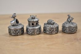 A collection of four R. Rice Woodsetton pewter miniature pill boxes, featuring woodland and nature-