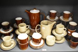 Two 20th-century Poole pottery tea services, featuring Broadstone and Chestnut, to include tea pots,