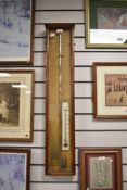 A Fitzroy storm-style barometer contained within a mahogany case, h90cm