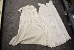 Two 20th century girls' white cotton nighties. Some small marks and discoloration due to age.