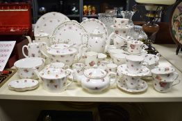A large 20th-century mixed tableware collection, mainly featuring rosebud and rose decorations,