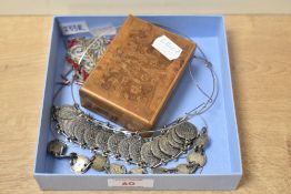 A small collection of white metal jewellery, comprising necklaces and bracelets with a wooden