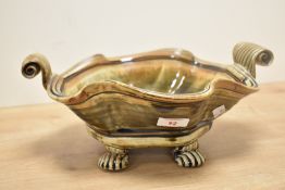 A 20th-century John Calver Studio pottery stoneware bowl, of a wavy organic shape with scrolled