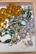 A small collection of beaded necklaces, including glass examples and clip on earrings