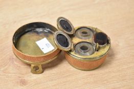 A Victorian double brass travelling inkwell, to include pen, brush, and glass ink wells, in a