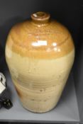 A large stoneware flagon having impressed marks for 'Rowland Atkinson Wine & Spirit Merchant