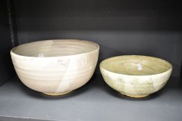 Two 20th-century studio pottery bowls, in chawan style; the larger featuring a subtle swirled