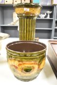 A large mid-20th-century West German pottery jardinière on matching fluted stand, featuring