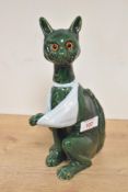 A late 19th to early 20th-century French Mosanic faience pottery seated cat, in a dark green