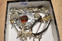 A small collection of costume jewellery, including a large Mizpah paste set brooch and a pair of