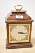 A mid-20th-century Elliot of London mahogany and brass mantel clock, featuring Roman numerals on a