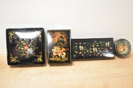 A collection of four 20th-century lacquered papier-mâché boxes, of rectangular, square and
