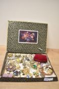 A large assortment of costume brooches, including statement pieces, paste set examples and RAF