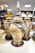 Three 20th-century Japanese Satsuma-style porcelain vase lamps, to include a set of two, of tall