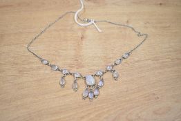 A silver moonstone set fringe necklace, the central pear cut moonstone cabochon having three pear