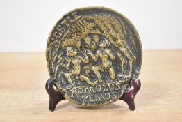 A mid 20th-century Max Le Verrier bronze pocket ashtray produced for Nestle, depicting the famous