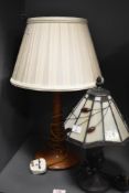A 20th-century Tiffany-style table lamp, featuring an Arts and Crafts-style slag glass lampshade