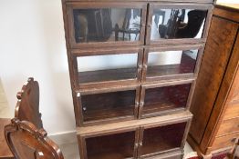 An early 20th Century oak stacking bookcase in the Globe Wernicke style comprising of four tiers,