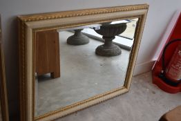 A modern wall mirror having distressed finish, approx. 94 x 74cm