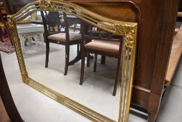 A modern gilt framed over mantel wall mirror, width 128cm