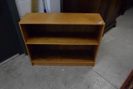 A traditional golden oak low bookshelf, dimensions approx. W100 H78 D29cm