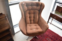 A vintage Vono Penthouse swivel chair having original corduroy fabric