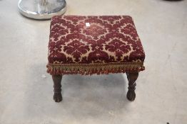 A 19th Century stool having upholstered top, width approx. 39cm
