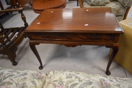 An early 20th Century mahogany coffee table having shaped apron and cabriole legs, dimensions