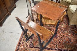 A Victorian and later school desk having cast iron frame, width approx. 61cm