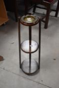 An early 20th Century oak smokers stand of tapering form