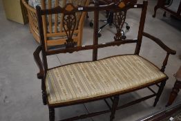 An Edwardian mahogany salon settee, width approx. 112cm