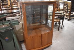 A laminate display cabinet, teak effect, width approx. 85cm