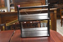 An Ercol stained elm wall mounted two-tier shelving unit 50cm x 43cm