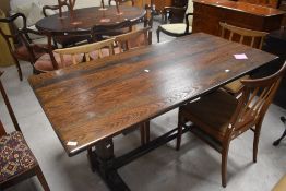 A modern oak refectory style dining table having bulbous column supports, approx. 152 x 77cm
